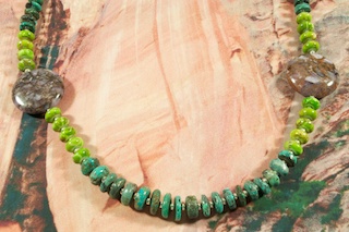 Two Stunning Charoite Disks Accent this Genuine Turquoise Necklace with Sterling Silver Beads. Charoite is a Beautiful and interesting gemstone first introduced in the US around 1976. It's vivid colors range from lavender to deep chatoyant purple. It is mined in Siberia Russia near Charo River, Lake Baikal region. High grade charoite is distinguished by mixtures of deep rich purple and silky zones, in swirly and/or needle-like chatoyant patterns/sprays. Created by Santo Domingo Artist Carol Pacheco.